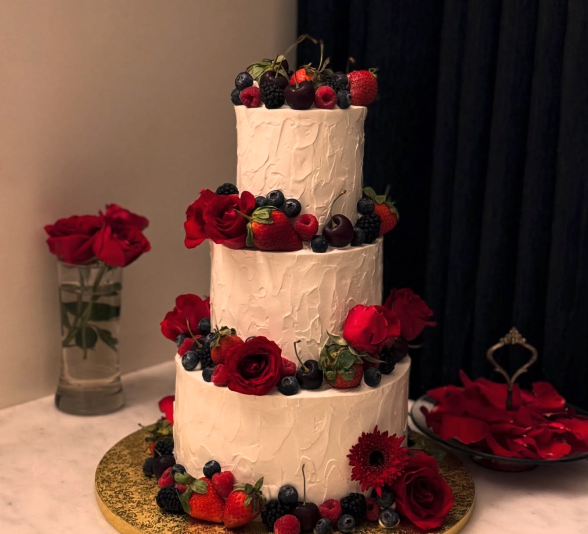 Tiered wedding cake with pearls and ribbon