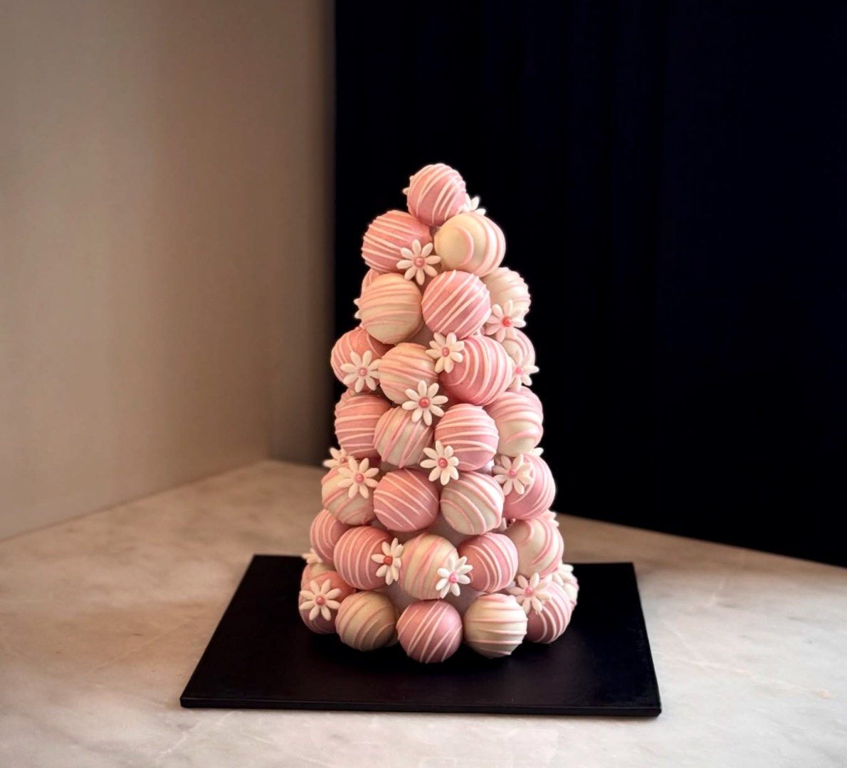 Tower of drizzled cake pop truffles